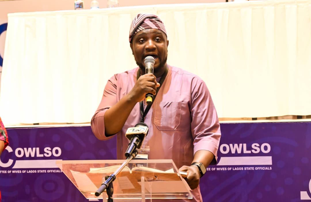 Abayomi speaking at a COWLSO podium
