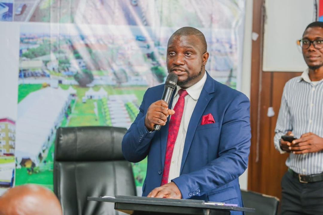 Abayomi speaking in a meeting room