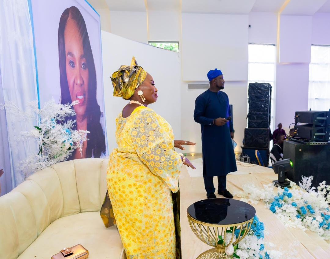 Wide view of Abayomi at a social stage