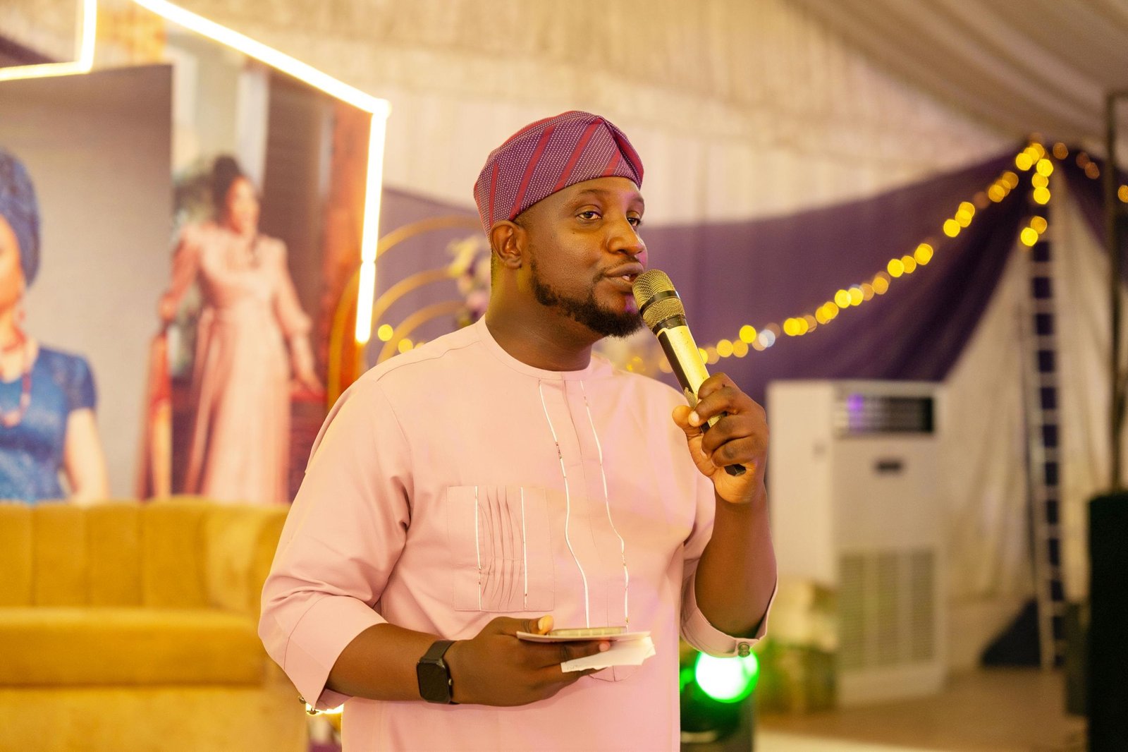 Abayomi speaking at a social event